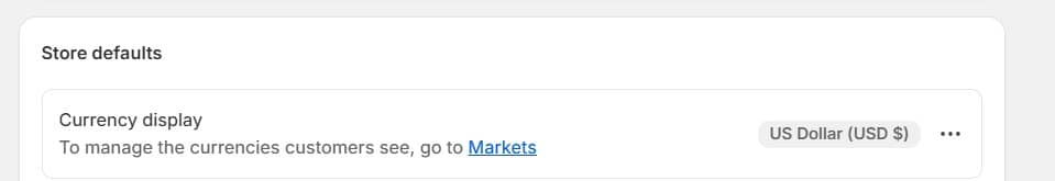 Configuración de Shopify con el campo Currency display en USD, dentro de Store defaults